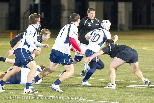 Jesuit Rugby Escapes “Mud Bowl” with Victories