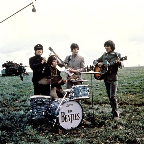 Image of the Beatles playing in a Field